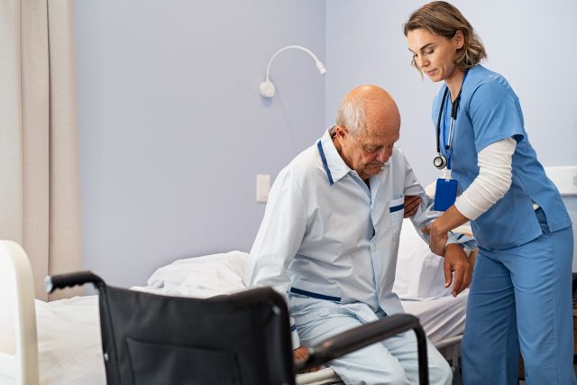 Nursing Assistant helping a senior patient in care