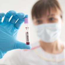 Novel Chinese Coronavirus blood test Concept. Nurse holding test tube with blood for 2019-nCoV analyzing.