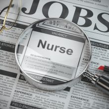 Nurse vacancy in the ad of job search newspaper with loupe. 3d illustration